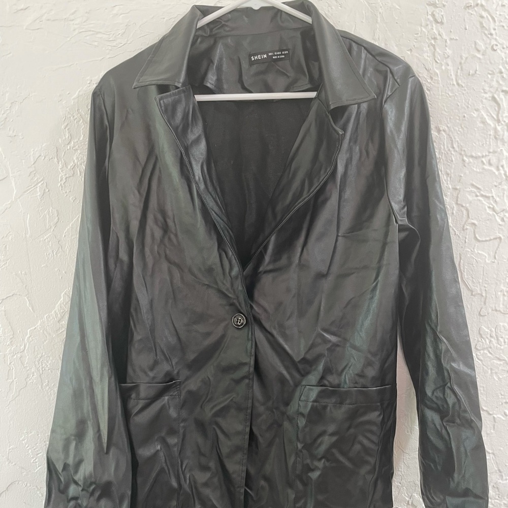 Distressed black leather trench coat